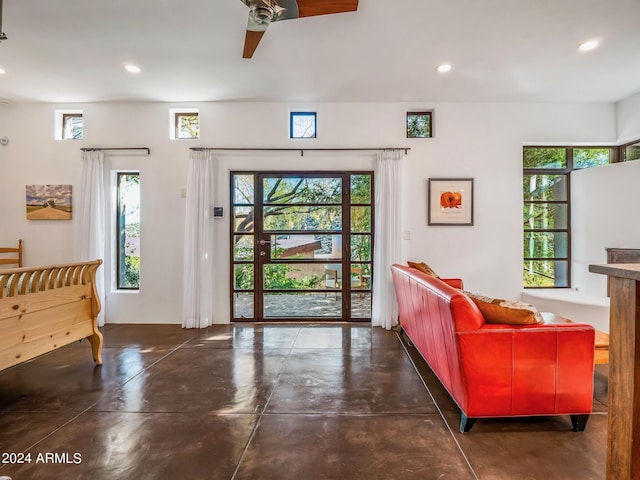 foyer entrance with ceiling fan