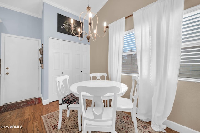 6708 W Utopia Rd, Glendale, AZ 85308 - dining room with a chandelier, wood finished floors, and crown molding