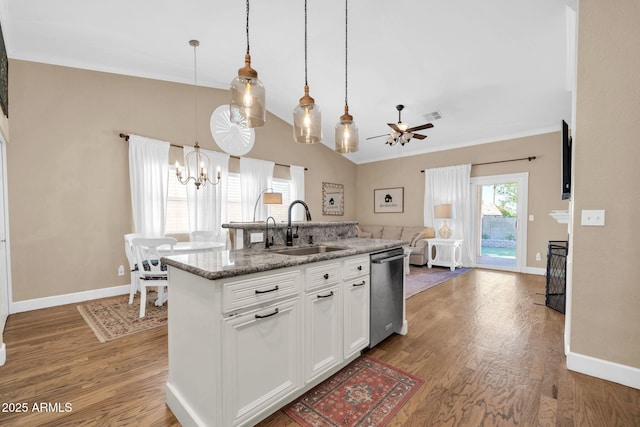 6708 W Utopia Rd, Glendale, AZ 85308 - kitchen with stainless steel dishwasher, a chandelier, open floor plan, wood finished floors, and a ceiling fan