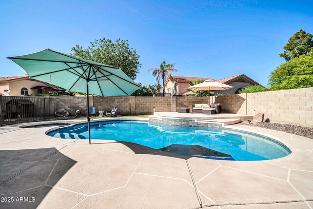 6708 W Utopia Rd, Glendale, AZ 85308 - view of swimming pool with a pool with connected hot tub, a patio, and a fenced backyard