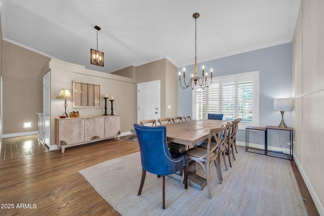 6708 W Utopia Rd, Glendale, AZ 85308 - dining space featuring a chandelier, wood finished floors, and crown molding