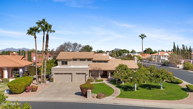 view of front of property featuring a garage, concrete driveway, a residential view, stucco siding, and a front lawn