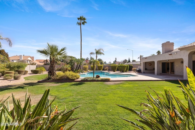 exterior space featuring a patio, fence, and a fenced in pool