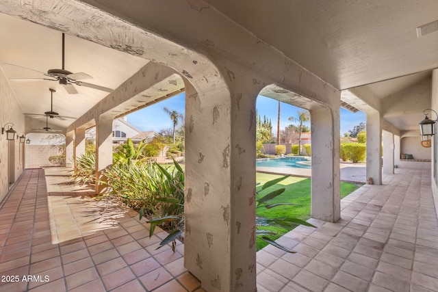 view of patio featuring an outdoor pool, visible vents, and a ceiling fan