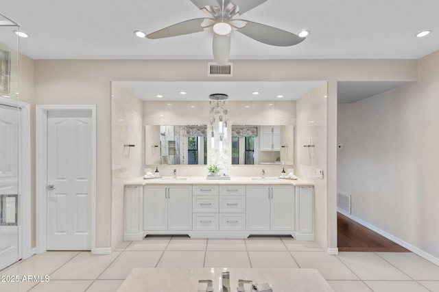 bathroom with tile patterned flooring, recessed lighting, a sink, visible vents, and double vanity