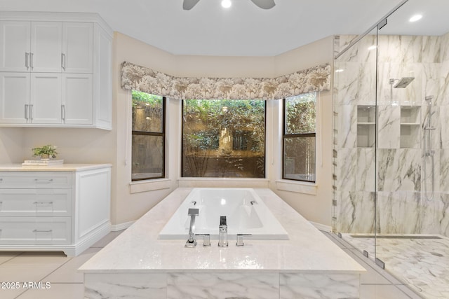 bathroom featuring recessed lighting, a marble finish shower, a bath, and a ceiling fan