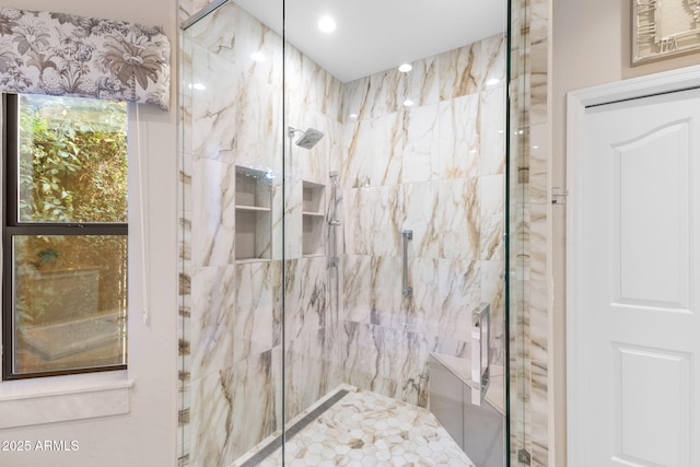 bathroom with a marble finish shower