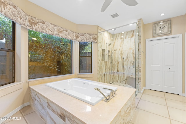 bathroom featuring tile patterned flooring, a marble finish shower, and visible vents