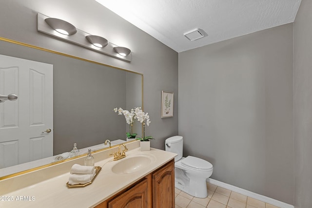 bathroom with visible vents, toilet, tile patterned flooring, a textured ceiling, and vanity