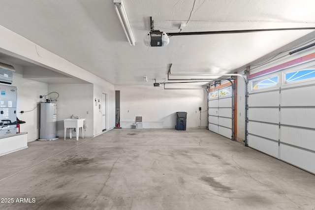 garage featuring a sink, electric water heater, and a garage door opener