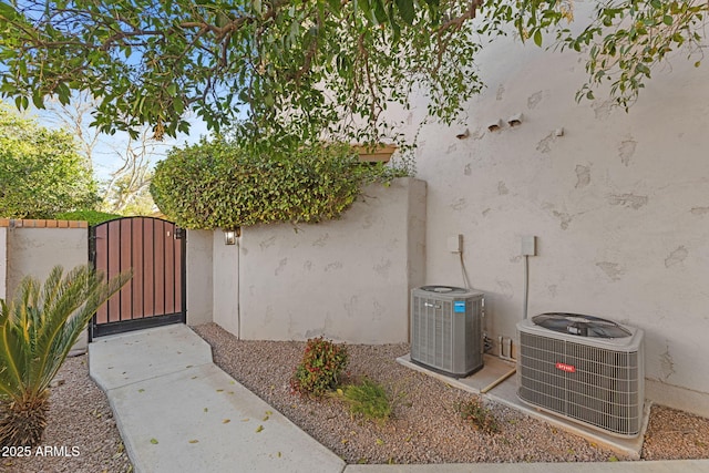 exterior space featuring fence and central AC unit