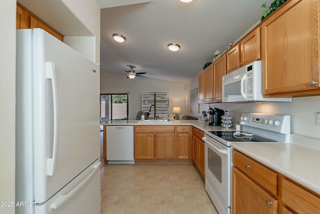 kitchen featuring white appliances, lofted ceiling, sink, ceiling fan, and kitchen peninsula