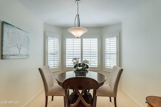 view of carpeted dining space