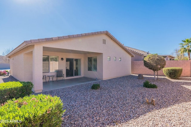 rear view of house featuring a patio