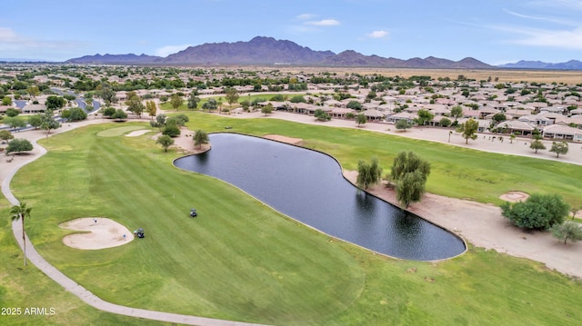 drone / aerial view featuring a water and mountain view