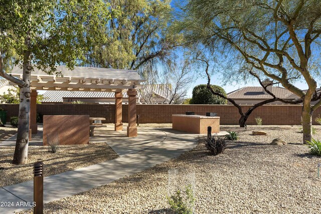 exterior space with a pergola and a patio