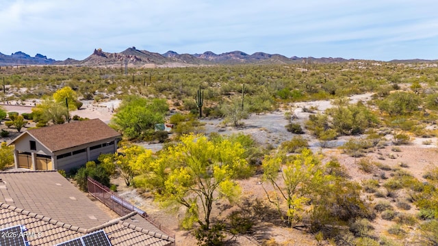 aerial view featuring a mountain view and a desert view