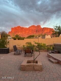 view of patio / terrace with a fenced backyard and a mountain view