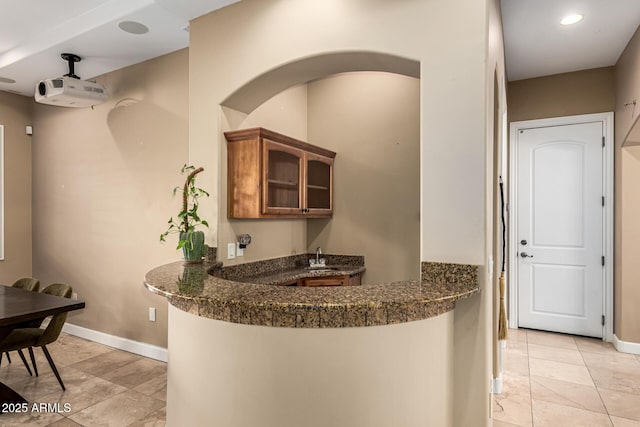 bar featuring indoor wet bar, recessed lighting, and baseboards