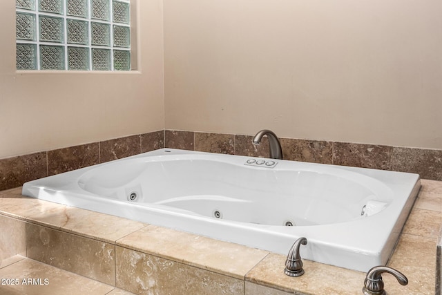 full bathroom with a jetted tub
