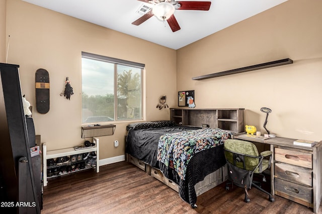 bedroom featuring baseboards, a ceiling fan, and wood finished floors