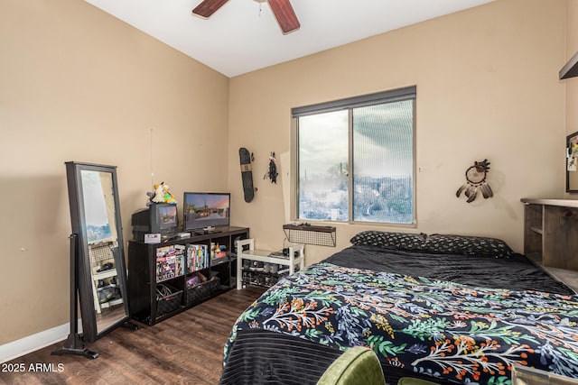 bedroom with a ceiling fan and wood finished floors