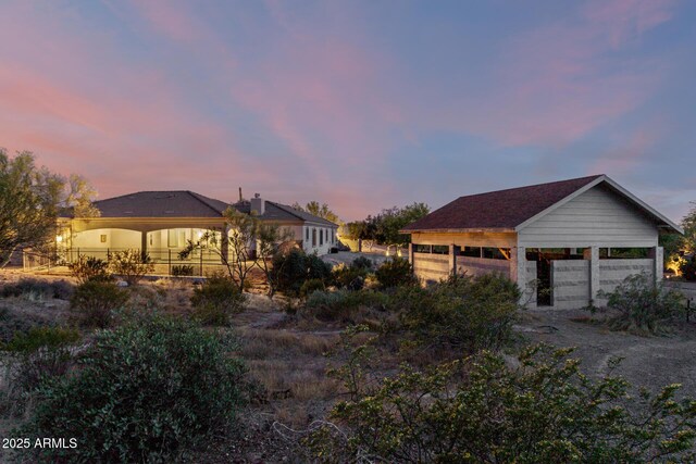 exterior space with a detached garage
