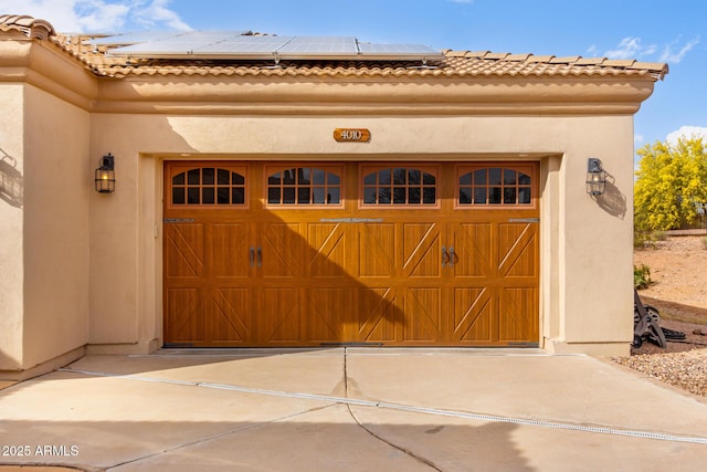 garage featuring solar panels