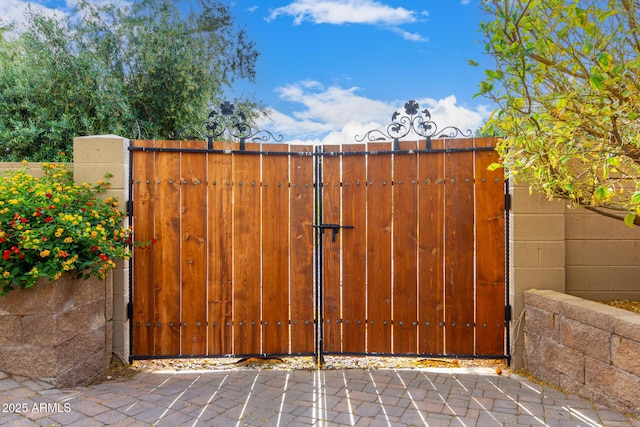 view of gate with fence