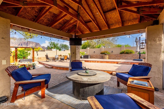 view of patio featuring a fenced backyard and a gazebo