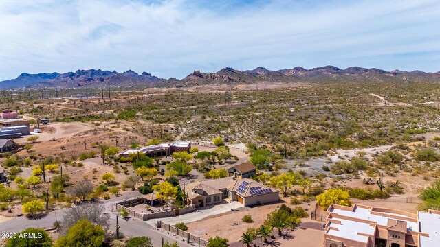 birds eye view of property with a rural view, a mountain view, and a desert view