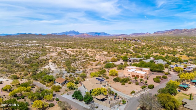 birds eye view of property featuring a desert view, a mountain view, and a residential view
