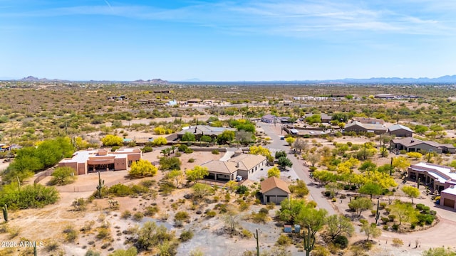 bird's eye view with a residential view, a mountain view, and a desert view