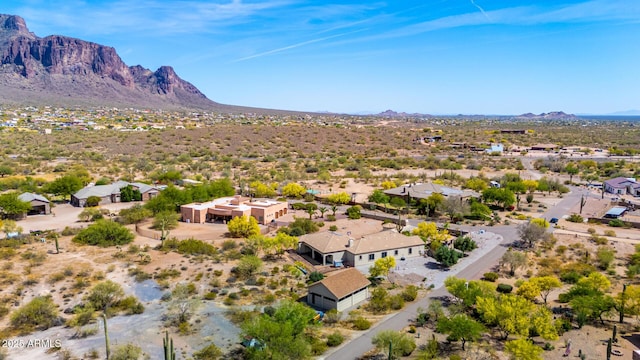 bird's eye view featuring a residential view, view of desert, and a mountain view