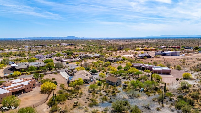 bird's eye view featuring a residential view, a mountain view, and view of desert