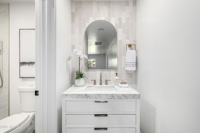 215 W Ruth Ave, Phoenix, AZ 85021 - bathroom with vanity, tile walls, and backsplash