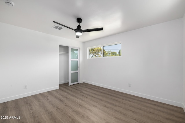 215 W Ruth Ave, Phoenix, AZ 85021 - unfurnished bedroom with wood finished floors, a closet, and ceiling fan