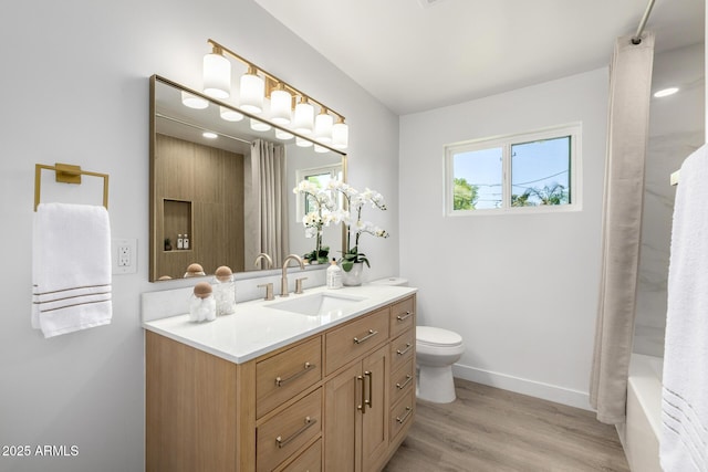 215 W Ruth Ave, Phoenix, AZ 85021 - bathroom featuring vanity, wood finished floors, and shower / bathtub combination with curtain