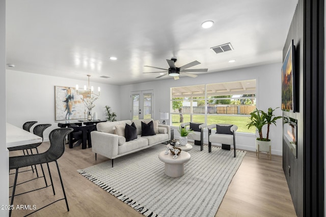 215 W Ruth Ave, Phoenix, AZ 85021 - living area with ceiling fan, light wood-type flooring, recessed lighting, and a chandelier