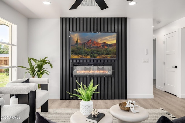 215 W Ruth Ave, Phoenix, AZ 85021 - dining area with wood finished floors, recessed lighting, a glass covered fireplace, and a ceiling fan