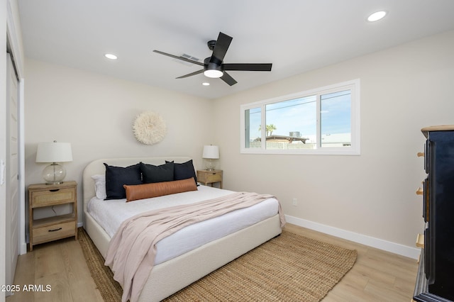 bedroom with baseboards, wood finished floors, recessed lighting, and a ceiling fan