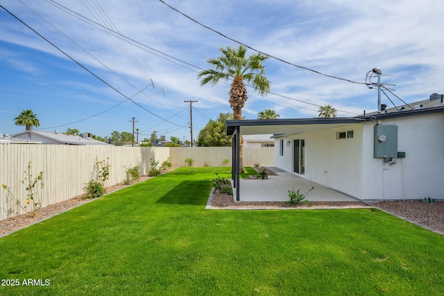 view of yard with a fenced backyard and a patio