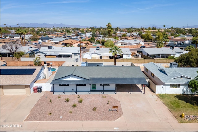aerial view featuring a mountain view and a residential view