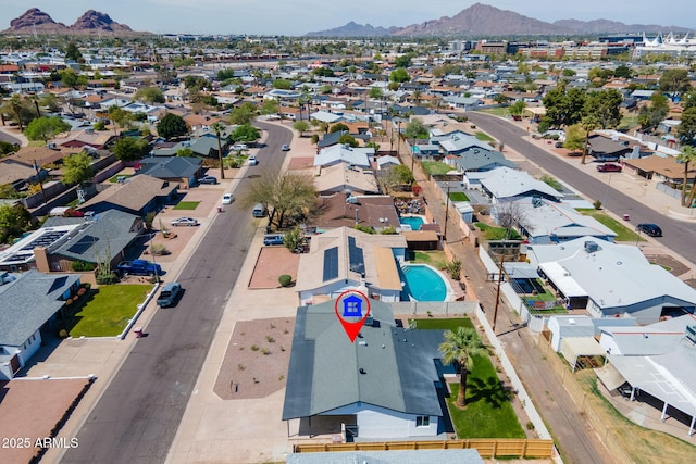 birds eye view of property with a residential view and a mountain view