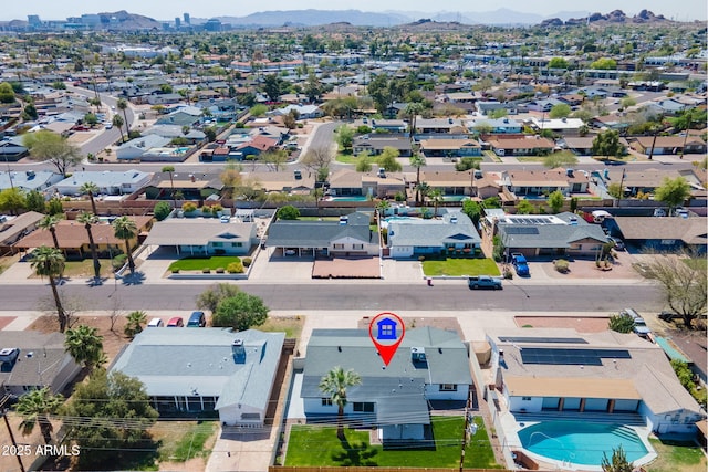 birds eye view of property with a residential view and a mountain view
