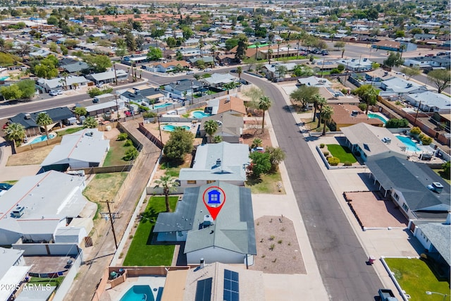 birds eye view of property with a residential view