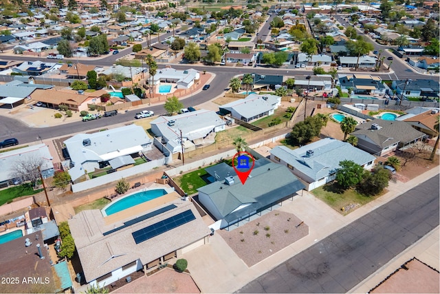 birds eye view of property with a residential view