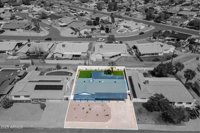 birds eye view of property with a residential view