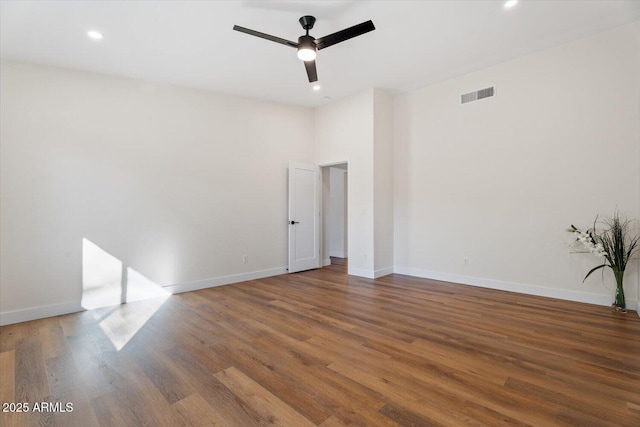 unfurnished room with wood-type flooring and ceiling fan