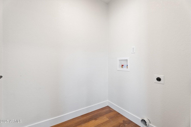 washroom with hookup for a washing machine, hardwood / wood-style floors, and electric dryer hookup